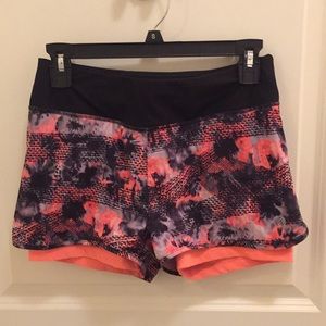 Pink and black running shorts with spandex